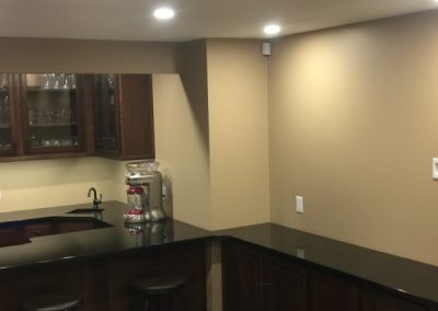 Finished basement counter with lighting and receptacles