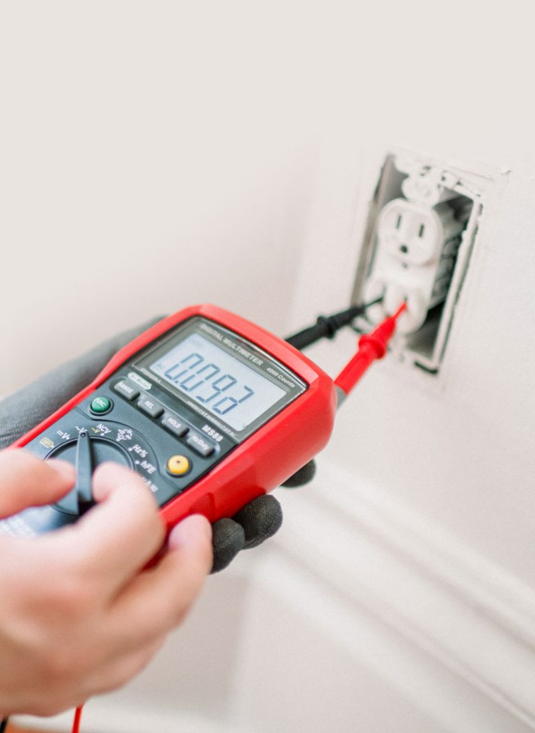 Electrician testing a residential receptacle