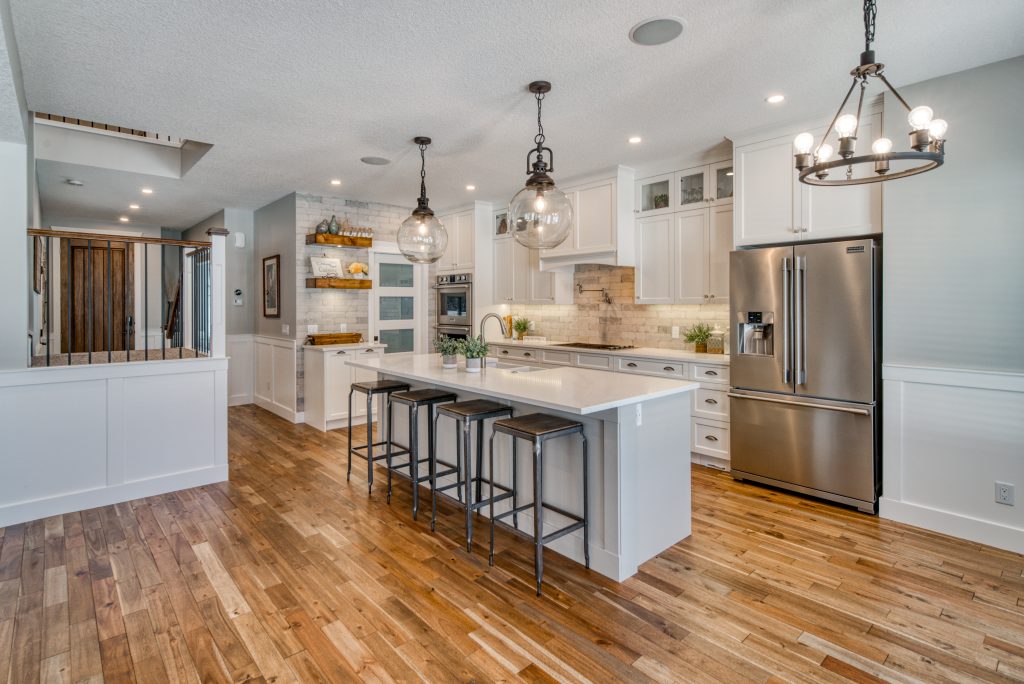 Bright finished kitchen with professionally installed lighting
